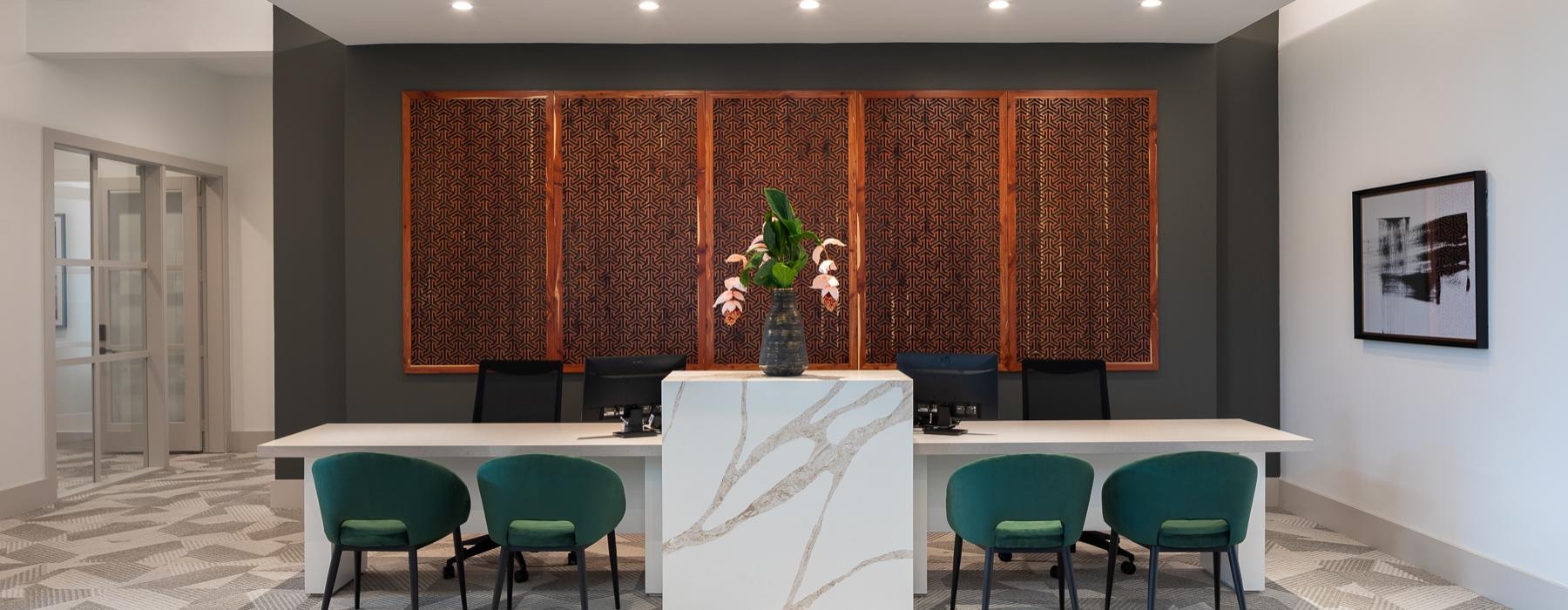 a room with a table chairs and a large screen